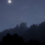 A crescent moon hangs over the Eastern hills.