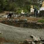 The north wall of the stupa forecourt is about half way done.