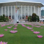 The front entrance to the conference hall. Vesak lotuses cover the lawn.