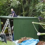 Bruce putting the finishing touches on a new storage shed.
