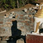 The south wall of the stupa forecourt. Light and shadow.