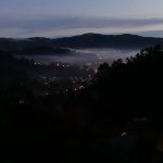 Looking down Stokes Valley from the monastery. The rectangle of light bottom is our dana sala skylight.