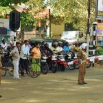 Traffic waits patiently as our train rattles its way to Kandy.