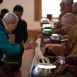 Ajahn Natawat a regular visitor to Bodhinyanarama receives an offering.