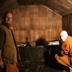 Ajahn Narado and venerable Kondanyo stripping out the rot and rubbish in the old sauna.
