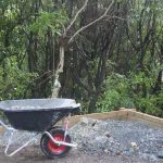 Rod wheels his wheelbarrow -