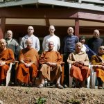 The Bodhinyanarama vassa group (plus Ajahn Hasapannyo) in front of the newly renovated Garden and Lotus kutis under the Raja. A post-vassa tea gathering.