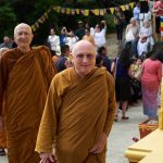 Monks arriving at the stupa.