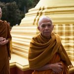 Monks arriving at the stupa.