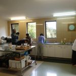 The home team busy in the kitchen.