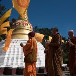 A clear sky and a gentle breeze carries us around the stupa.