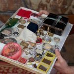 The collection of sacred objects to be interred under the buddha rupa.