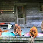 A broom making session at the back of the sala.