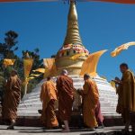 Offerings are made at the stupa after the circumambulation.