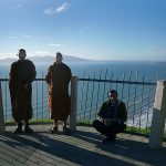 Ajahn Dta and Kusalo enjoy the view of the Kapiti coast on the way to Palmerston North with Indranath.