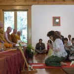 Khun Siriwam dedicates the offering of forest cloth to the sangha.