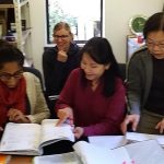 Sachini (left) giving guidance to the financial team (Christina Irene & Hwa). The photo is a bit out of focus but they are all very focussed.