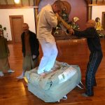 Getting the marquee back in the bag is always a creative dance. Bryce and Ajahn Joe are applying their persuasive feet to the job - with Jet as a stabilising hand.