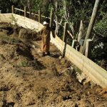 Venerable Bhuripanyo just arrived from Australia helping out with the retaining wall. Sadhu.!