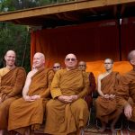 Stupa dedication: monks assembled in front of the west side reclining buddha rupa.