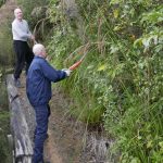 Jamie and Jet tidying up Ajahn Kusalos kuti access track. A bit of a vege trim and some gravel on the surface.
