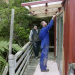 Bruce adapting to his new role of supervisor. Bryce putting some finishing touches to Architect kuti.