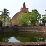 The large water tank in front of the central stupa.