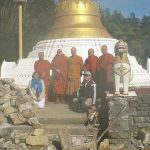 Visiting monks - amidst the rubble.