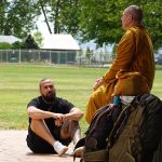 Tudong: By the lake at Rotorua. One of our kind food donors sharing some dhamma.