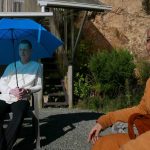 Anagarika Ryan and Ajahn Joe enjoy a bright winters day on the bhikkhu vihara patio.