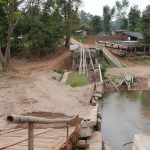 Royalty was on their way to open this bridge. A flash flood saved them the bother. This is the raft factory for tourist excursions down river.