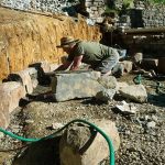 The south side of the stupa forecourt. Simon hard at work. Those stones are not small.