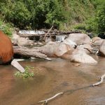 A rest along the way and a chance to bathe in the clean and cool river and do a bit of laundry. The dam is a fish weir.