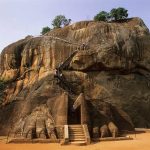 This level area is about half way up the rock. There was a massive lion enclosing the entrance. Only the paws remain.