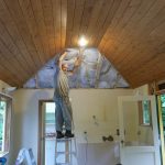 Bruce in his not uncommon elevated and illuminated state preparing to reinstate the ceiling in the Raja kuti - having cleared the rats out of the roof! Relocated kitchen visible through the doorway.