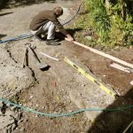 Lindsay preparing the workshop entrance for a long awaited patch of concrete.