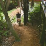 Richard delivering the last barrow load of dirt to form the new access track to the Garden kuti.