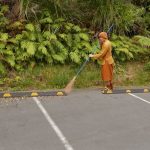 Ajahn Dta making a clean sweep of the car park.
