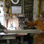 Ajahn Kusalo and Lindsay working on the posts for the stupa safety rail. A boring job :)