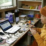 Ajahn Dta working on the new dhamma hall lighting controller.