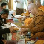 Gifts are offered to the Sangha.