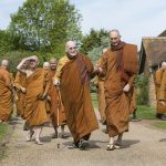 Leaving the dhamma hall.