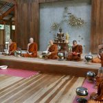 The sala at Tan Khantikos monastery. The abbot in front of the shrine.