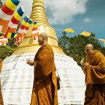 The Sangha processes around the stupa chanting blessings.
