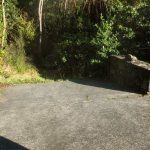 The back side (West) of the stupa. An open hole that leaks into the bush.