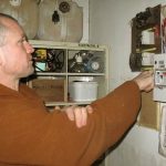 Venerable Issaro working his magic with final touches to the new dormitory wiring.