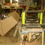 As much a photo of the new planer and sander in action as of Bruce putting finishing touches to the new book display.