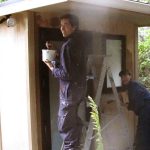 Sebastian and Anna begin painting the new monks toilet.