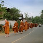 On alms round in Bung Wai the village adjacent to Wat Pah Nanachat.
