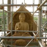 The new stone Buddha rupa on the second level of Ajahn Aneks new uposatha hall.